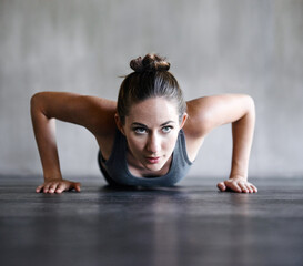 Canvas Print - Pushup, fitness and woman on a floor for training, cardio and endurance at gym. Push up, exercise and female athlete at a health center for core, strength and ground workout with determined mindset