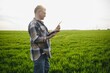 © Serhii - Portrait of senior farmer agronomist in wheat field. Successful organic food production and cultivation.