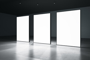 Three blank white glowing banners in dark hall interior with concrete floor and black walls. Presentation concept. Mockup, closeup, 3D Rendering