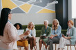 © gstockstudio - Group of mature women listening to speaker while visiting training class together