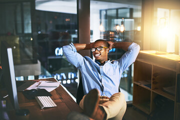 Fototapete - Night, business and man relax, employee and creative with startup success, company development and computer. Male person, entrepreneur or consultant working late, chilling or technology in the office
