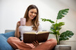 © ivanko80 - Beautiful  woman reading a book at home