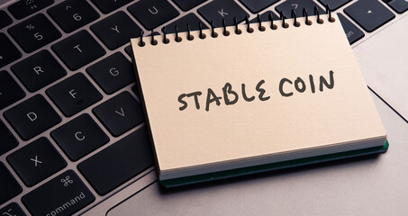 Poster - There is notebook with the word Stablecoin.It is as an eye-catching image.