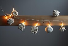 Various Lighted Snowflakes On String Attached To Other Objects, Generative Ai