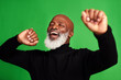 © Chanelle Malambo/peopleimages.com - Happy, dance and face of of black man on green screen for celebration, music or excited. Happiness, smile and energy with senior person dancing isolated on studio background for freedom and movement