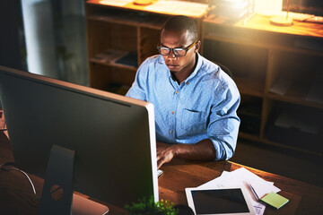 Fototapete - Business man, night developer and computer with office typing and project web research. African male worker, technology and coding for online website management for company with tech and internet
