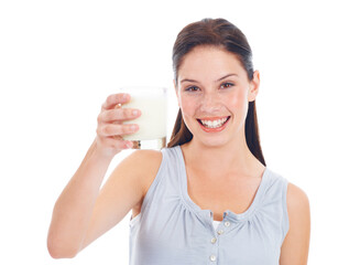 Portrait smile, woman and glass of milk for vitamin D healthcare benefits, bone health or nutritionist hydration drink. Calcium dairy product, wellness and studio model isolated on white background