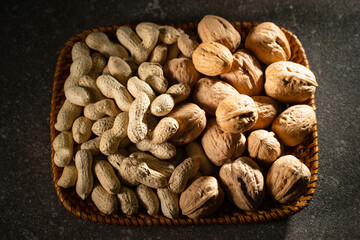 Canvas Print - Peanuts and walnuts on a plate