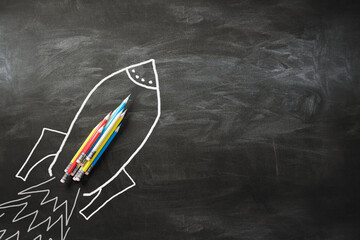 Poster - Creative idea and business startup concept with stack of pencils on drawn on chalkboard background with place for your advertising poster rocket, startup. 3D rendering, mock up