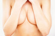 © Yuri Arcurs/peopleimages.com - Cover, closeup and breast of woman in studio for sensual, cleavage and temptation. Nude, topless and chest with body of girl for attractive, flirting and desire isolated on white background