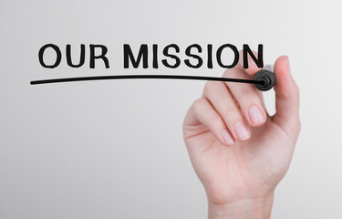 Poster - womans hand writing word our mission with marker