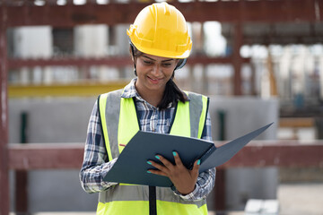 India engineer woman working with document at precast site work