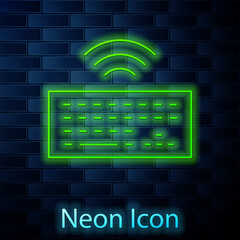 Poster - Glowing neon line Wireless computer keyboard icon isolated on brick wall background. PC component sign. Internet of things concept with wireless connection. Vector