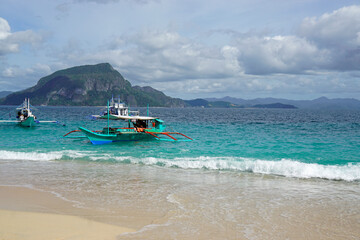 Wall Mural - traditional wooden outrigger boats on palawan island