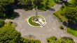 Aerial view of the Falcone e Borsellino public park located in the historic center of Latina, Lazio, Italy. In the center of the gardens is an obelisk dedicated to war dead.