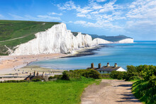 The Seven Sisters Chalk Cliffs And The Coastguard Cottages During A Eraly Summer Day, Seaford, East Sussex, England