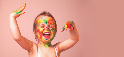Beautiful  little baby girl doing make up (humorous picture) Copy space.