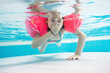 © Photocreo Bednarek - Young girl diving in the pool having fun in waterpark