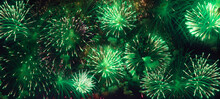 Colorful Green Fireworks On Black Sky Background Banner