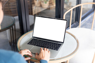 computer screen blank mockup.hand woman work using laptop with white background for advertising,contact business search information on desk at coffee shop.marketing and creative design