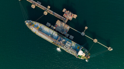 crude oil floating station in sea, bridge pipeline load unloading crude oil from oil ship transport,