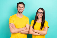 Photo Of Two Confident Brother With Sister Wear Yellow T-shirts Brand Stylish Eyeglasses Crossed Hands Promo Banner Isolated On Cyan Color Background