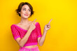 Portrait of cheerful pretty cute lady wear stylish clothes demonstrate empty space summer discount isolated on yellow color background