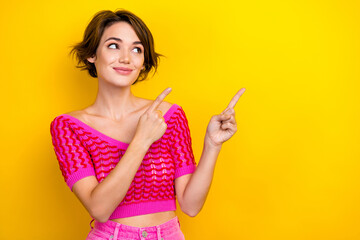 Wall Mural - Portrait of cheerful pretty cute lady wear stylish clothes demonstrate empty space summer discount isolated on yellow color background