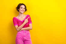 Photo Of Toothy Beaming Positive Girl Dressed Off Shoulder Shirt Indicating At Promo Empty Space Isolated On Yellow Color Background