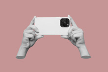 Mobile Phone With Photo Camera In Female Hands Isolated On A Pink Background. Mockup Of A Smartphone. Young Woman Takes Picture. 3d Trendy Collage In Magazine Style. Contemporary Art. Modern Design
