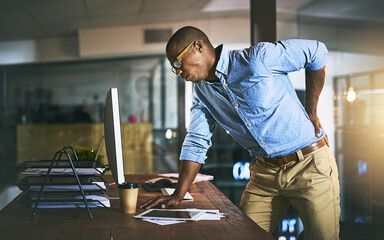 Fototapete - Black man with back pain, night business and stress with injury, health problem and burnout from overtime. Male professional work late, backache and medical emergency with bad posture and overworked