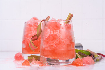 Wall Mural - Refreshing summer rhubarb sour fizz cocktail, frozen fizz cocktail, sweet rhubarb slushy with sirup, rum and champagne. Refreshing cold and healthy summer cocktail