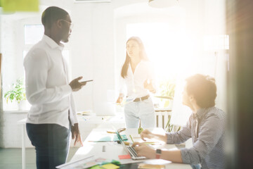 Sticker - Group of diverse colleagues discussing project in meeting room in office