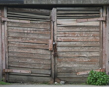 Closed Old Wooden Gate With Peeling Paint