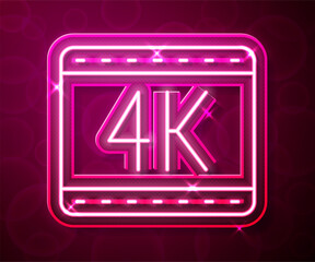 Sticker - Glowing neon line 4k movie, tape, frame icon isolated on red background. Vector