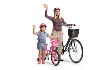 Canvas Print - Little girl with her mother waving and standing with a bicycle