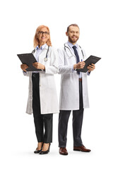 Poster - Male and female doctors standing and holding clipboards