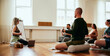 © Flamingo Images - Yoga instructor teaching breathing exercises