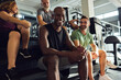 © Flamingo Images - Diverse people laughing on steps at the gym