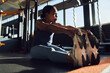 © Flamingo Images - Woman stretching on a gym floor