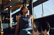 © Flamingo Images - Woman sitting on a gym floor