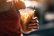 A woman holding a cup of iced coffee with a straw, ai generative