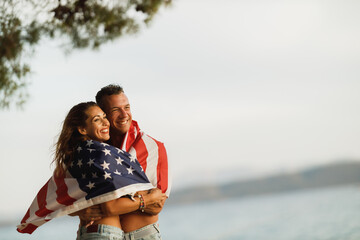 Canvas Print - Couple In Embrace With American National Flag