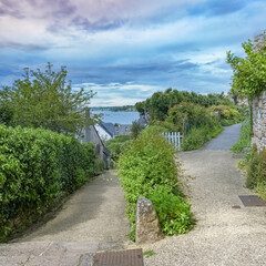 Wall Mural - Brittany, Ile aux Moines island in the Morbihan gulf, old houses in the village, with view on the harbor
