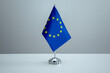 © Jahid - EU flag in a stand on table