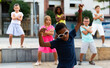 © JackF - Young boys and girls dancing outdoors. They're performing street dance moves and having fun.