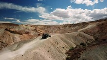 UTV Driving Up A Desert Trail