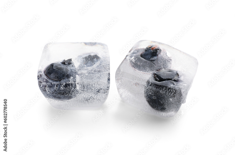 Fresh blueberry frozen in ice cubes on white background
