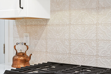 Wall Mural - encaustic tiled backslash behind an oven area and cabinets