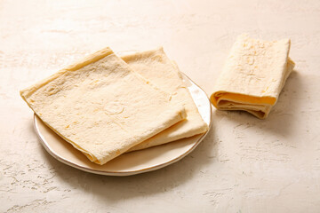 Wall Mural - Plate with fresh lavash on light background